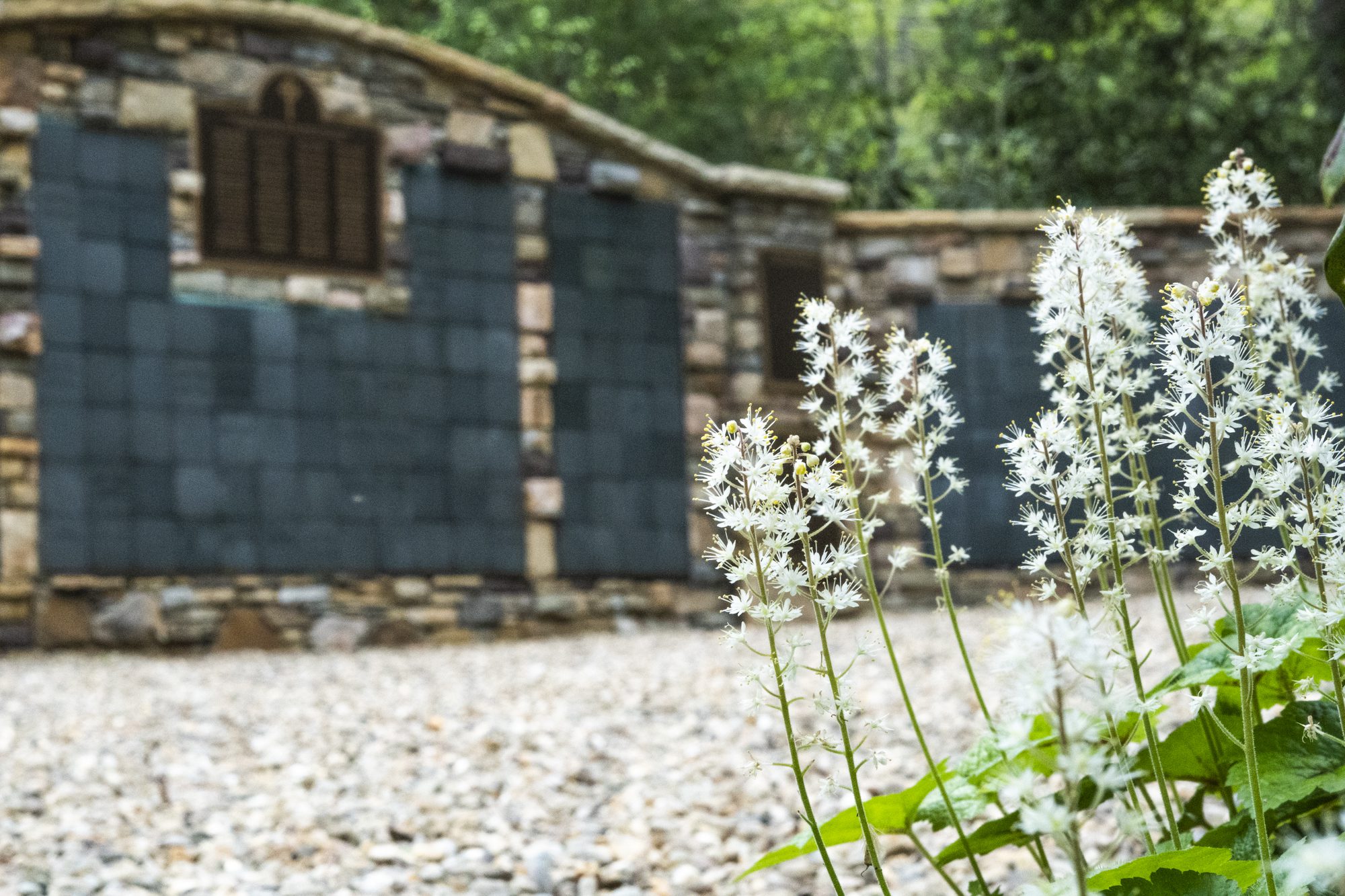Montreat Conference Center columbarium with white flowers in the foreground.